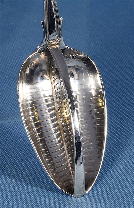 A George III silver straining spoon, Length 12”/305mm Weight: 5.3oz/149grms.